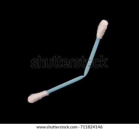Soft cotton swabs isolated on black background