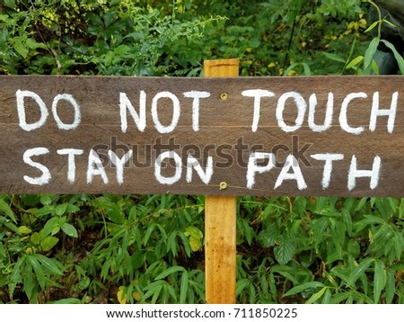 do not touch stay on path sign