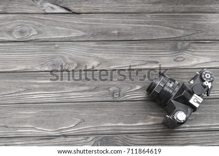 old camera on a wooden table