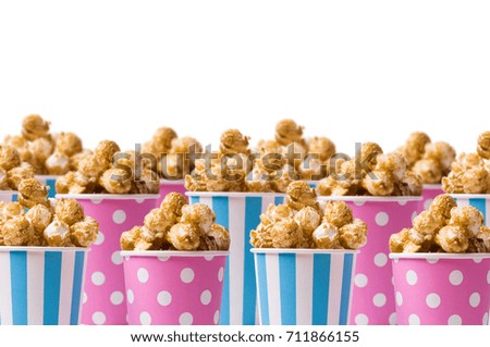 Popcorn with caramel taste on a white background. Selective focus.