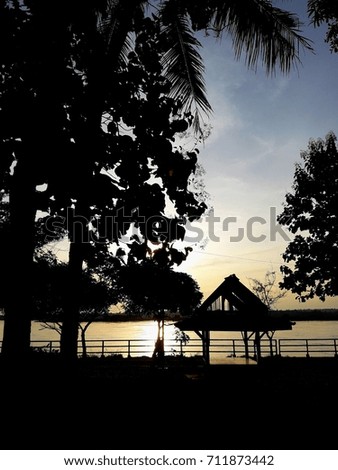 Waterfront pavilion at sunset on the river, Thailand

