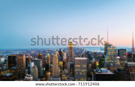 Blurred travel backgrounds - NY, USA. Aerial view on the city skyline in New York City, USA, on a summer night with beautiful sky