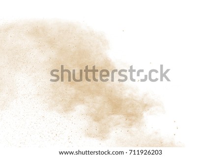 abstract brown color powder explosion on  white background.abstract  Freeze motion of brown color powder exploding.