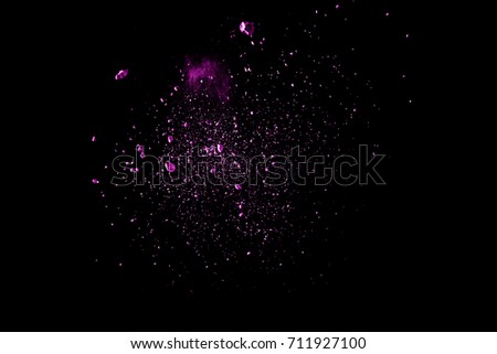 abstract purple color powder explosion on  black background.abstract  Freeze motion of purple color powder exploding.
