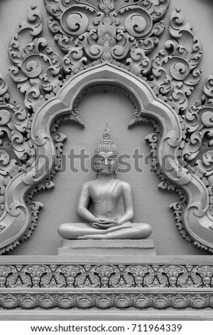 Thai  Buddha carving on the wall in the temple, Thailand