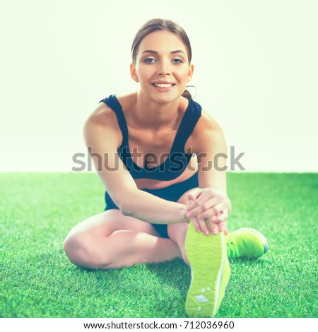 Portrait of sport girl doing stretching exercise