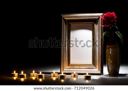 Blank mourning frame for sympathy card on dark background
