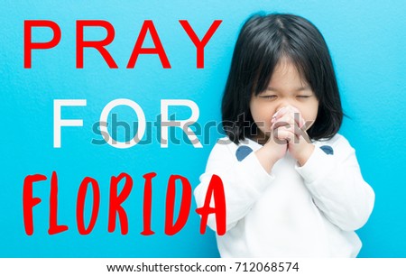 Pray for Florida.Little girl hand praying for stop wind and storm surge.Hurricane Irma Pray for Florida and American people the symbol of humanity for Hurricane natural disaster in Florida.