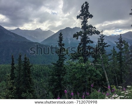 Atmospheric layers of blue mountains on a summer day. Royalty-Free Stock Photo #712070998