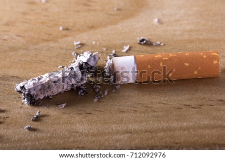 Cigarette butt and ash