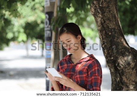 Young girl using smartphone in Vietnam