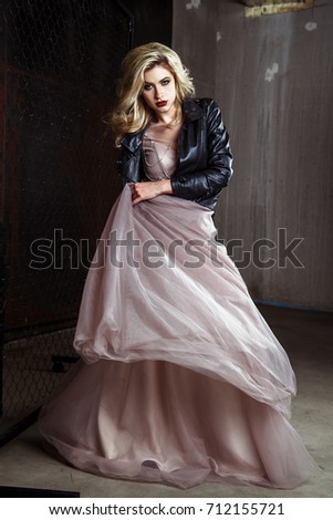 Beautiful blonde young bride woman in color wedding dress. rock style, fashion beauty photo