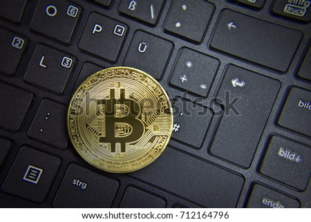 Bitcoin on Keyboard- Gold Coin - Cryptocurrency with space for your own text - Concept