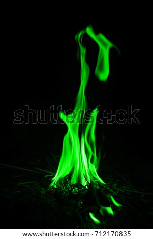 Freeze motion of green fire flames burning. Maybe use for backdrop. Fire concept.