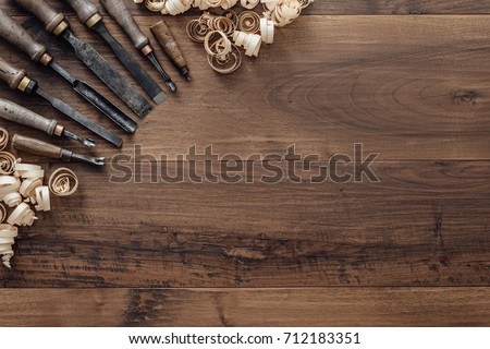 Old carpentry tools on a workbench and blank copyspace: woodworking, craftsmanship and handwork concept, flat lay Royalty-Free Stock Photo #712183351
