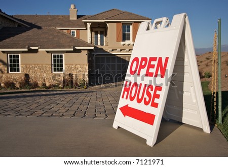 Open House Sign in Front of A Brand New Home. Room for your own message at the top of the sign.
