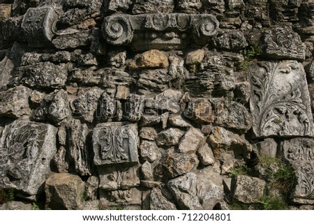ancient bas-relief cobblestones wall 