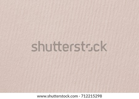 A warm-toned, off-white paper background with a finely textured swirling thread texture. High resolution photo.