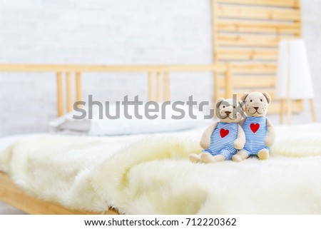 Couple or lover doll bear on the bed in bedroom.