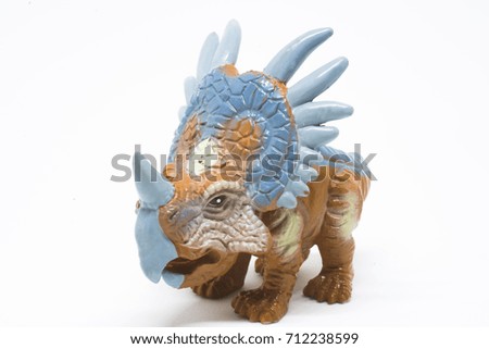 Cute dinosaur toy on white background