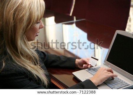 Woman doing online shopping with her credit card