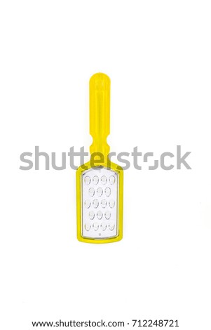 yellow manual grater for vegetables on white background