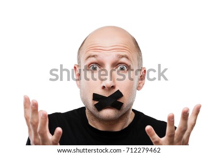 Forbidden word or speech censorship concept - scared adult man adhesive tape closed mouth white isolated Royalty-Free Stock Photo #712279462