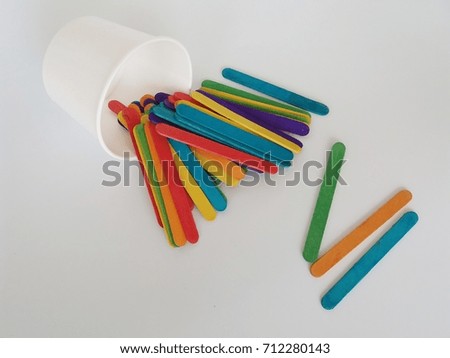 Colorful ice cream sticks and cup on white background/selective focus.