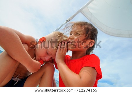 Comforting a friend. Young girl hugs her adorable boy.