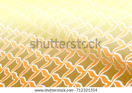 Texture, background, pattern. Abstraction. Yellow background. Rhombuses of turquoise color. Texture of fabric
