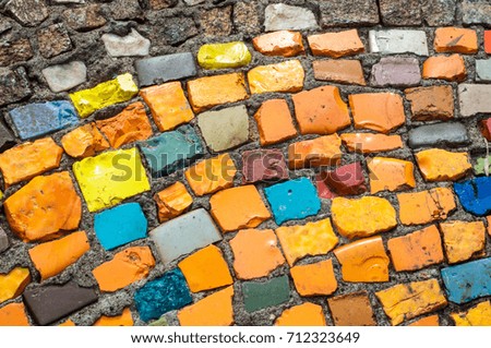 Texture, background, pattern. Closeup photo of multi-colored mosaic stones. Structure design decor. Swimming pool wall and floor finishing