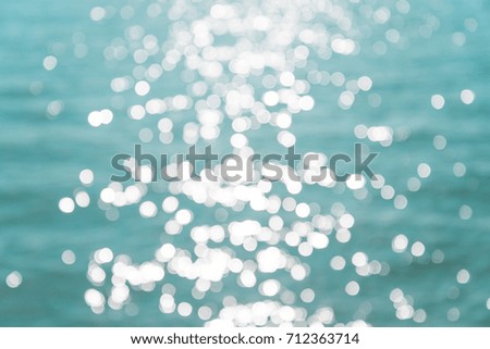 Abstract blur beautiful tropical island beach with sunlight background summer holiday concept
