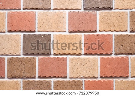 Brick wall background, texture of red stone blocks closeup