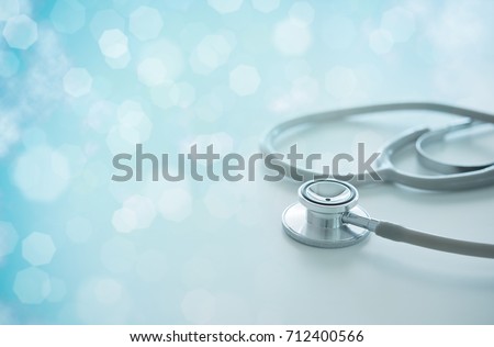 Medical concept. Stethoscope on doctor desk with abstract science hexagon in background.
