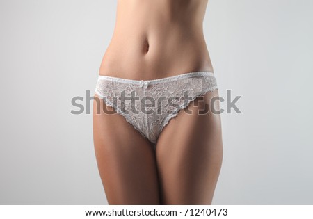 Closeup of a woman's waist wearing panties Royalty-Free Stock Photo #71240473