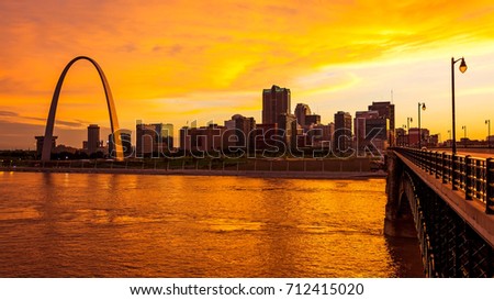 St Louis, Missouri cityscape skyline and Gateway Arch as night falls over downtown (logos removed for commercial use) Royalty-Free Stock Photo #712415020