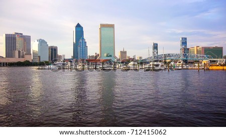 Jacksonville, Florida city skyline over the St. John's River (logos blurred for commercial use)