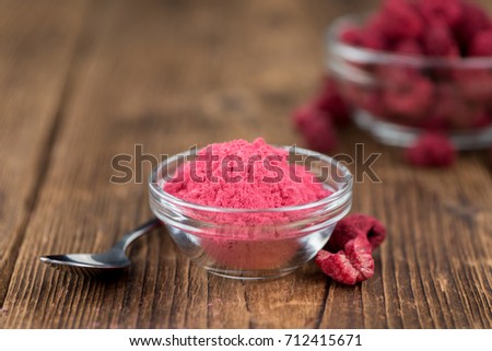 Homemade Ground Raspberries on vintage background selective focus; close-up shot