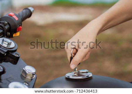 Hand the key open tank cap motorcycle fuel tank.