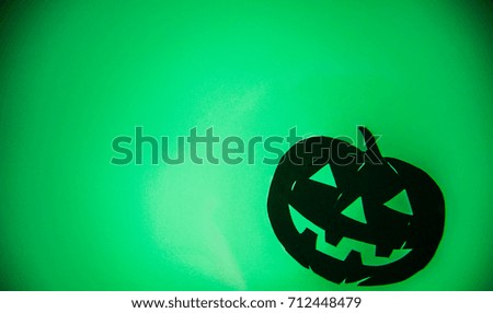 Halloween pumpkin on green background. Poster or banner for Trick or Treat Halloween party with scary pumpkin.