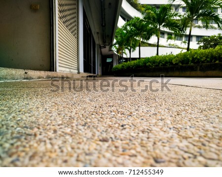 Exposed aggregate finish walkway decoration. / Composing picture with blur background and high contrast.