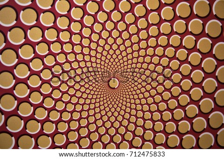 Optical illusion with circles that create the effect of motion, as a background