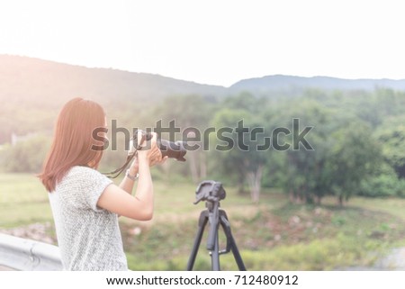 Travel take photo Public landmark, Young women take photo landscape, Woman holding dslr camera for shooting image in holiday,Travel take photo tourist camera photography concept