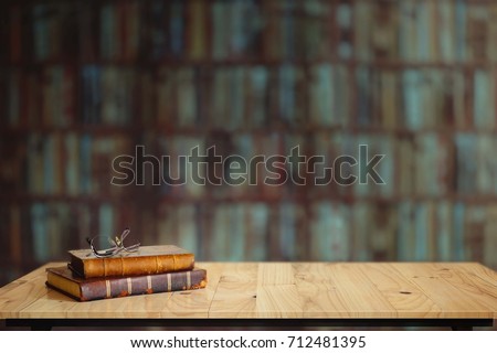 Vintage books on table in library. Royalty-Free Stock Photo #712481395