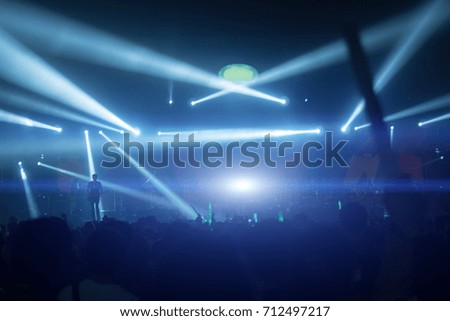 Silhouette hands of audience crowd people  enjoying the club party concert ,Celebrate new year party , Blurry night club party music dancing sound , Party People Blurred Background