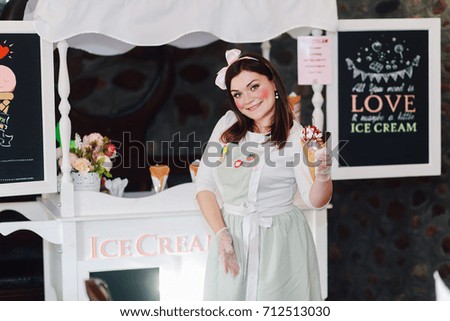 Cheerful young girl, an ice cream seller