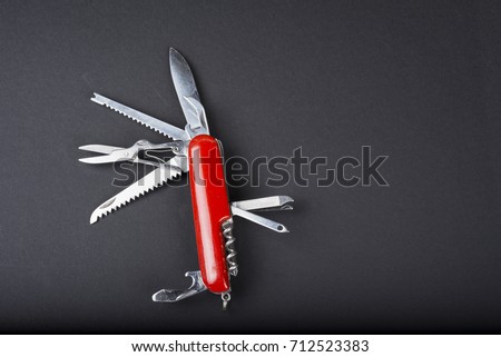 Many task army  knife on white background