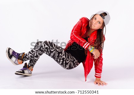 Break Dance Rap hip hop girl in cool pose in a red jacket and a gray cap white background