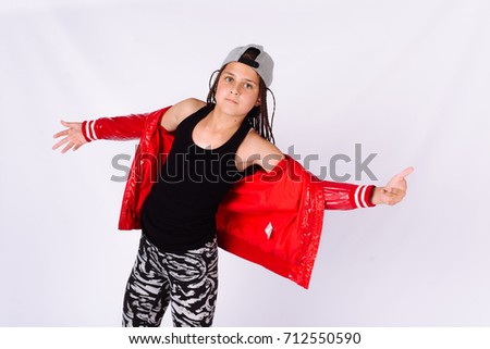 Break Dance Rap hip hop girl in cool pose in a red jacket and a gray cap white background