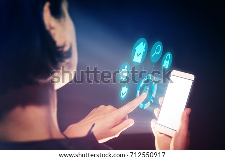 Image of a woman with a smartphone in her  hand. She makes transactions with real estate using her gadget.